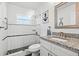 Updated bathroom featuring granite countertops, modern fixtures, and a walk-in shower at 292 42Nd Ave, St Pete Beach, FL 33706