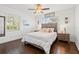 Relaxing bedroom featuring a comfortable bed, tasteful decor, and large windows for natural light at 292 42Nd Ave, St Pete Beach, FL 33706