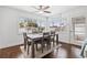 Open dining area with modern table, chairs, and abundant natural light from large windows at 292 42Nd Ave, St Pete Beach, FL 33706