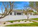 Well-maintained white home with a charming picket fence and nicely landscaped front yard at 292 42Nd Ave, St Pete Beach, FL 33706