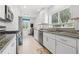 Charming kitchen featuring granite countertops, modern appliances, and bright natural light at 292 42Nd Ave, St Pete Beach, FL 33706