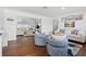 Spacious living room with hardwood floors and comfortable seating, showcasing the open and inviting atmosphere at 292 42Nd Ave, St Pete Beach, FL 33706
