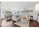 Bright living room featuring an open floor plan, modern decor, and large windows offering plenty of natural light at 292 42Nd Ave, St Pete Beach, FL 33706