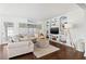 Bright living room with a comfortable couch, a built-in shelving unit, and elegant decor at 292 42Nd Ave, St Pete Beach, FL 33706