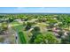 Expansive aerial view of meticulously maintained golf course surrounded by lush landscapes at 3210 Mcmath Dr, Palm Harbor, FL 34684