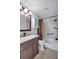 Bathroom featuring a modern vanity, updated fixtures, and a shower-tub combination at 3210 Mcmath Dr, Palm Harbor, FL 34684