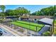 Community bocce ball court with covered seating and adjacent shuffleboard courts at 3210 Mcmath Dr, Palm Harbor, FL 34684