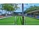 Well-maintained bocce ball court with benches and plenty of space for community fun at 3210 Mcmath Dr, Palm Harbor, FL 34684
