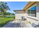 Back exterior view shows the stucco siding, window, and AC unit at 3210 Mcmath Dr, Palm Harbor, FL 34684