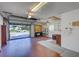 Spacious garage with ample shelving and storage, featuring an open door and view of the neighborhood at 3210 Mcmath Dr, Palm Harbor, FL 34684