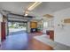 Spacious garage with ample shelving and storage, featuring an open door and view of the neighborhood at 3210 Mcmath Dr, Palm Harbor, FL 34684