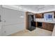 Bright kitchen showcasing black appliances, wooden cabinetry, and an open layout for functionality and style at 3210 Mcmath Dr, Palm Harbor, FL 34684