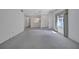 Spacious living room with large windows and neutral carpet offers a bright and airy feel at 3210 Mcmath Dr, Palm Harbor, FL 34684