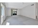 Bright living room featuring a sliding glass door that lets in natural light and provides access to outdoors at 3210 Mcmath Dr, Palm Harbor, FL 34684