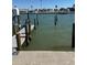 Private dock extends into the tranquil water, providing easy access for boating at 337 Rex Pl # B, Madeira Beach, FL 33708