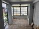 Sunroom with tiled flooring, ample natural light, and ceiling fan, ideal for relaxation or entertaining at 337 Rex Pl # B, Madeira Beach, FL 33708