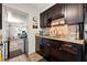 Kitchen featuring dark cabinetry, granite countertops, and modern sink fixtures at 438 39Th N Ave, St Petersburg, FL 33703