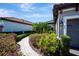 Beautiful landscaping with brick paver walkway leads to the front of this well maintained property at 4614 Alexandria Ct, Palmetto, FL 34221