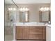 Modern bathroom with a glass-enclosed shower and double sink vanity at 501 S Willow Ave, Tampa, FL 33606