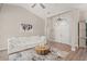Bright living room showcasing high ceilings, hardwood floors, and a cozy seating arrangement at 5141 Sunnydale W Cir, Sarasota, FL 34233