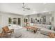 Sun-filled living area featuring stylish decor, seating, and open floor plan at 5141 Sunnydale W Cir, Sarasota, FL 34233