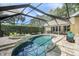 Gorgeous pool and spa with a screened enclosure and brick patio at 5141 Sunnydale W Cir, Sarasota, FL 34233