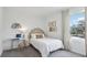 Bright bedroom features a statement headboard, desk and chair with an abundance of natural light at 5230 Salt Marsh Rd, Wimauma, FL 33598