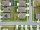 Drone view of the property and neighborhood with well maintained yards and neighborhood streets at 6241 Spider Lily Way, New Port Richey, FL 34653
