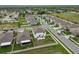 An aerial view of a well-maintained home featuring a fenced backyard and patio set at 6241 Spider Lily Way, New Port Richey, FL 34653