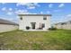 Exterior backyard view with patio furniture set and grill at 6241 Spider Lily Way, New Port Richey, FL 34653