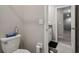 Half bath showcasing neutral walls, black bath mat and open doorway at 6241 Spider Lily Way, New Port Richey, FL 34653