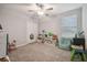 Bedroom has neutral walls, carpet, ceiling fan, window, and closet at 6241 Spider Lily Way, New Port Richey, FL 34653