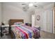 Cozy bedroom featuring a ceiling fan, carpeted floor and closet at 6241 Spider Lily Way, New Port Richey, FL 34653