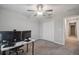 Bedroom featuring neutral walls, carpet, closet, doorway and office area at 6241 Spider Lily Way, New Port Richey, FL 34653