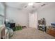 Bedroom with neutral walls, carpet, ceiling fan and assorted toys at 6241 Spider Lily Way, New Port Richey, FL 34653