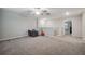 Bonus room with a ceiling fan and neutral carpet at 6241 Spider Lily Way, New Port Richey, FL 34653