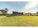 Entrance to Copperspring featuring sign, stone wall, and lush lawn at 6241 Spider Lily Way, New Port Richey, FL 34653