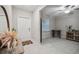 Neutral entryway with tile flooring and decor, offering a clean and modern aesthetic at 6241 Spider Lily Way, New Port Richey, FL 34653