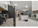 Modern kitchen with stainless steel appliances, granite counters and a center island with a breakfast bar at 6241 Spider Lily Way, New Port Richey, FL 34653