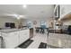 Modern kitchen seamlessly connecting to the dining and living areas, offering an open and inviting space at 6241 Spider Lily Way, New Port Richey, FL 34653