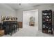 The living room has a bar and decor, creating an inviting and functional space for relaxation and entertainment at 6241 Spider Lily Way, New Port Richey, FL 34653