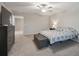 Spacious main bedroom with a ceiling fan and neutral carpet at 6241 Spider Lily Way, New Port Richey, FL 34653