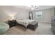 Spacious main bedroom with a ceiling fan and natural light at 6241 Spider Lily Way, New Port Richey, FL 34653
