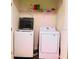 Practical laundry area equipped with a washer and dryer at 6272 Bucket Ct, Gibsonton, FL 33534