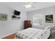 Sports-themed bedroom with a comfortable bed, ceiling fan, and a classic vintage design is inspiring at 6345 Vista Verde E Dr, Gulfport, FL 33707