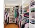 Organized walk-in closet with custom shelving and ample storage for all your wardrobe needs is convenient at 6345 Vista Verde E Dr, Gulfport, FL 33707