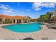 Community pool with lounge chairs and umbrellas near multi-story residential buildings at 6345 Vista Verde E Dr, Gulfport, FL 33707