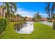 Community view of the pond and walkway and the exterior of the multi-story residences at 6345 Vista Verde E Dr, Gulfport, FL 33707