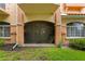Exterior view of the property with a screened-in patio and well-manicured lawn and landscaping at 6345 Vista Verde E Dr, Gulfport, FL 33707
