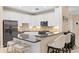 Well-lit kitchen features stainless steel appliances, granite countertops, and a convenient breakfast bar at 6345 Vista Verde E Dr, Gulfport, FL 33707